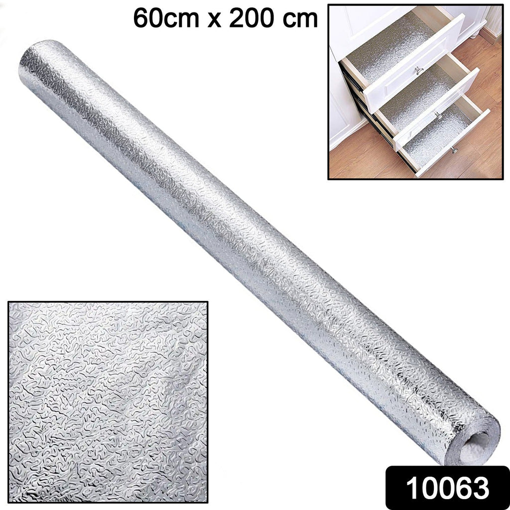 Kitchen wall protected by heat-resistant aluminum foil wallpaper.