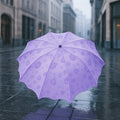 A closed Magic Umbrella with a subtle blossom pattern, ready for rain surprises.