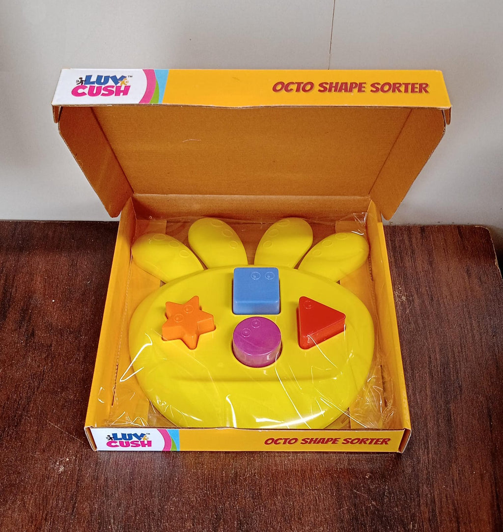 Packaging and components of the Octo Shape Sorter Toy, showcasing its contents.
