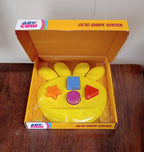 Packaging and components of the Octo Shape Sorter Toy, showcasing its contents.