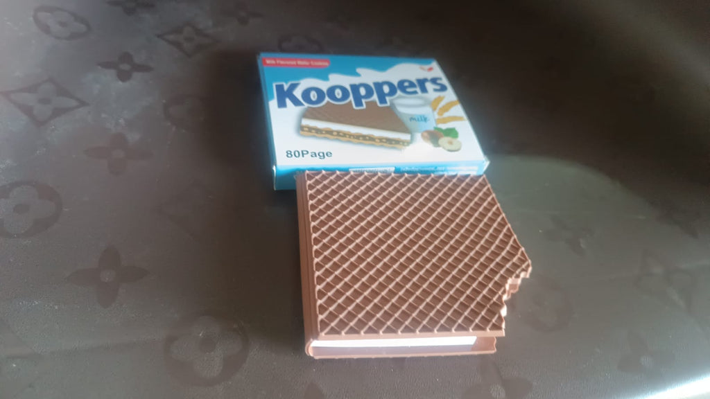 Overhead shot of the Chocolate Diary Notebook, emphasizing its compact size and design.