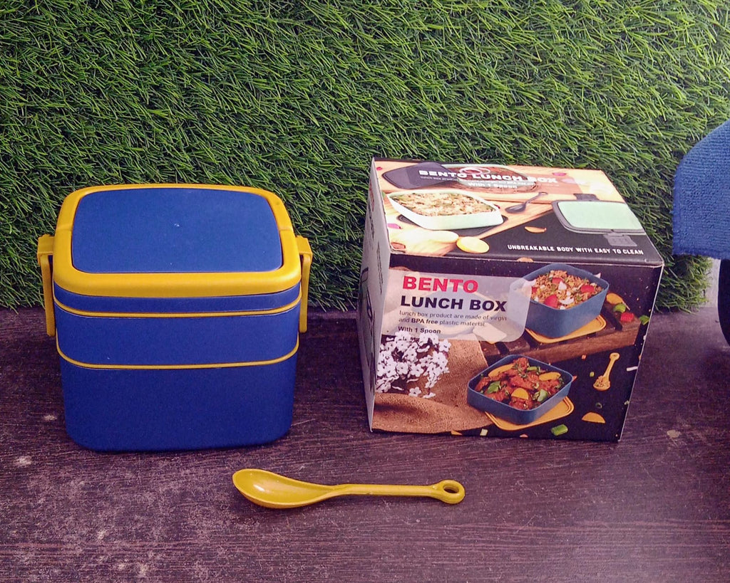 The complete blue portable bento lunch box with spoon and ergonomic carrying handle.