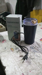 Mini coffee grinder blender ready to grind fresh coffee beans.