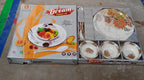 The 18-piece plastic dinner set packaged in a colorful box, ideal for gifting.