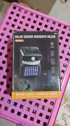 Lifestyle image of the Solar Bug Zapper providing light and pest control.