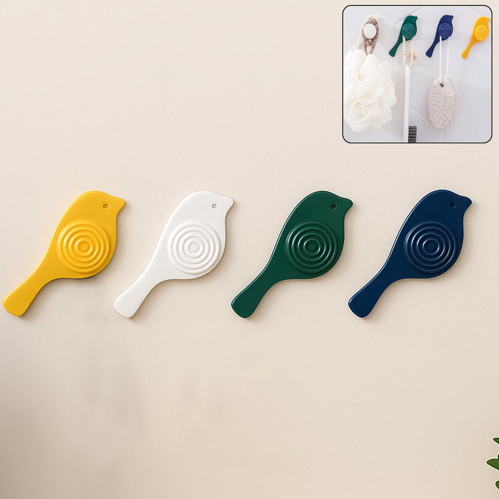A set of four elegant self-adhesive bird hooks displayed against a clean wall.
