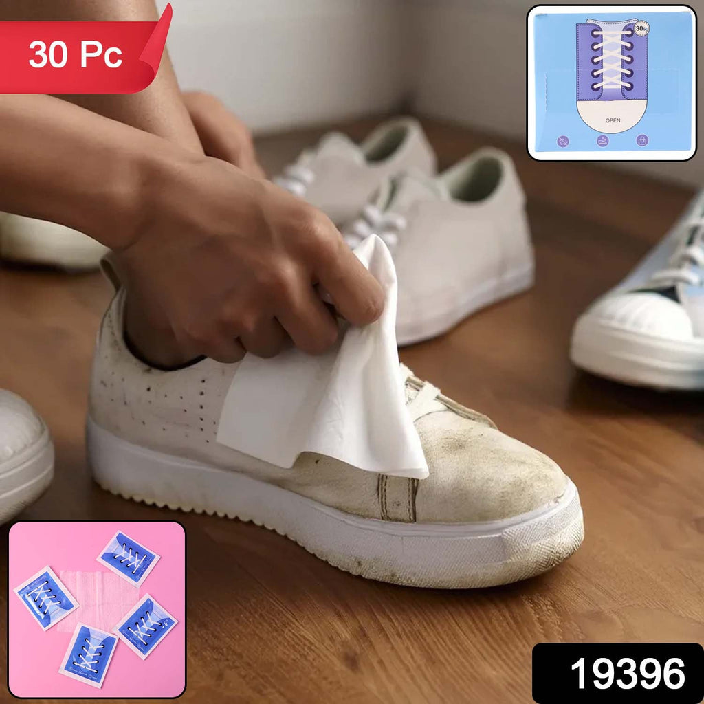 Person cleaning white sneaker with shoe cleaning wipe