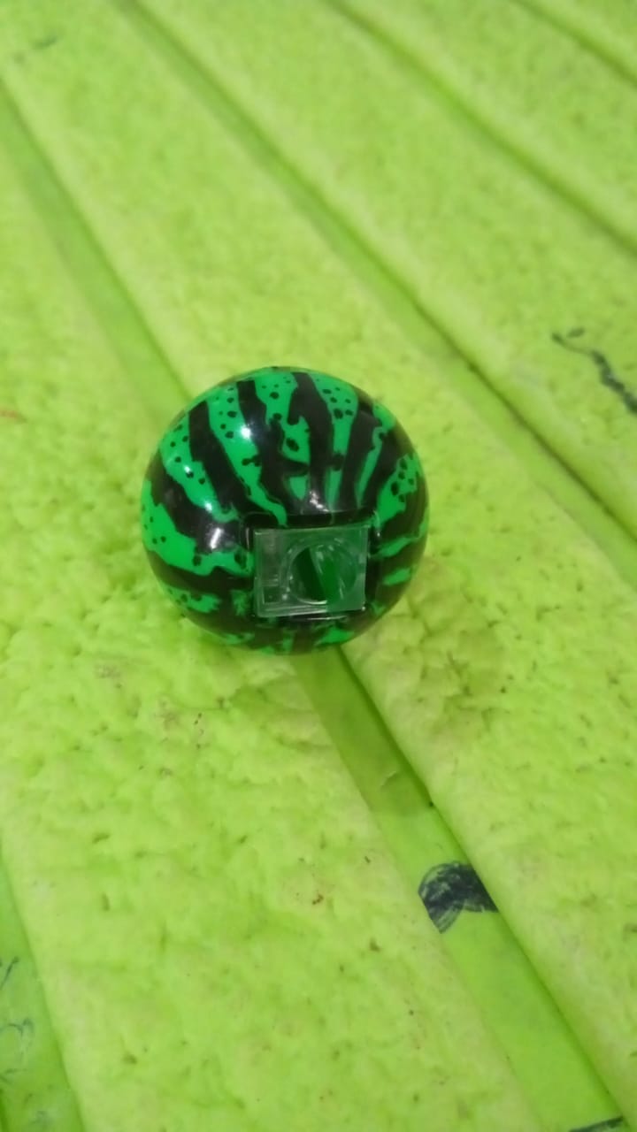 Watermelon pencil sharpener shown from side angle, highlighting smooth surface