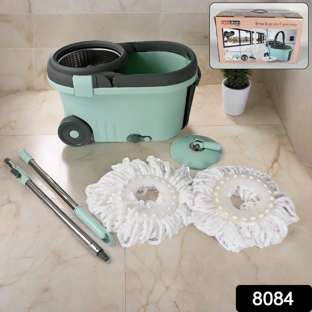 Close-up view of the Ganesh Spin Mop's microfiber head and adjustable stainless steel handle.