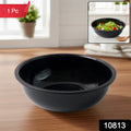 Black plastic serving bowl filled with curry showing deep design