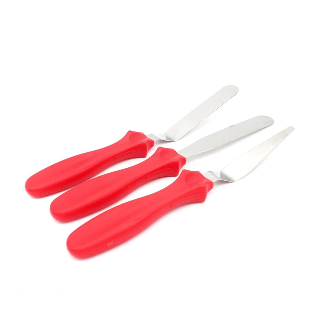 An overhead view of the full stainless steel cake icing spatula set, ready for any baking project.