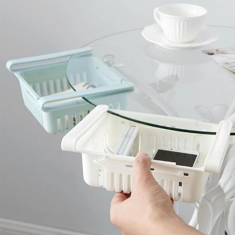 Empty adjustable fridge storage basket showcasing its clear, durable design.