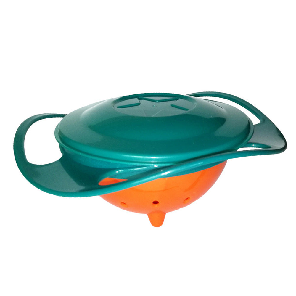 A toddler enjoying a mess-free snack from the 360-degree rotating spill-proof gyro bowl.