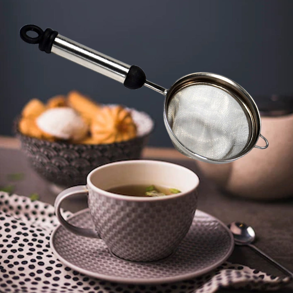Fine mesh stainless steel strainer ready to filter juice or tea.