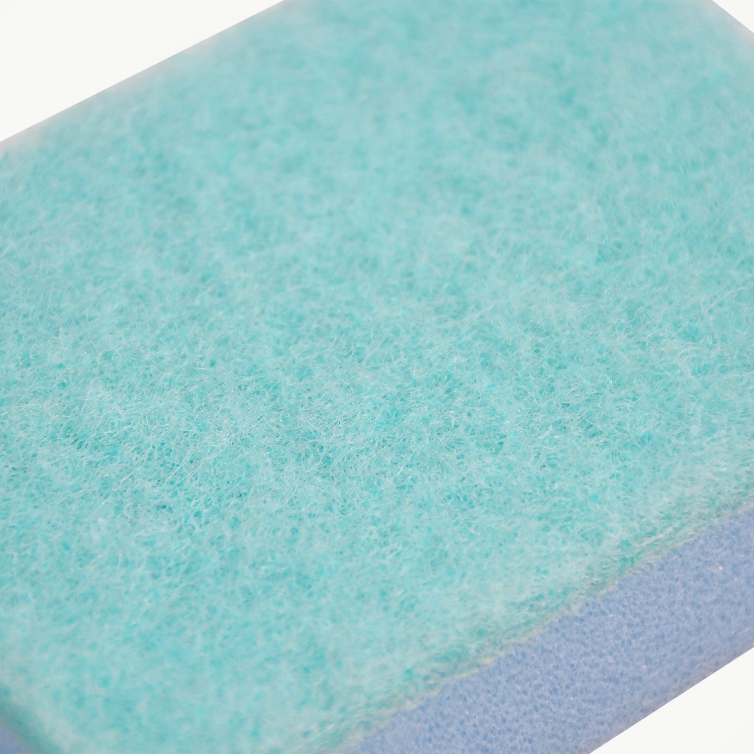 Textured surface of a robust cleaning sponge, designed for tough stains.