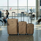 Side view of brown soft side 3-piece luggage set