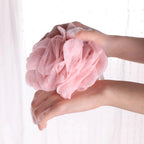 Bath loofah shown creating rich lather for deep cleaning.