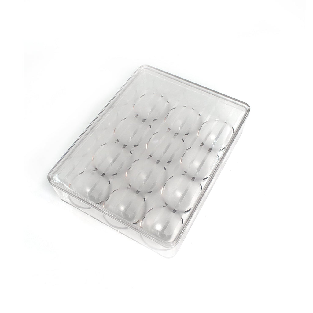 Hand placing an egg into the 12-cavity egg organiser for neat storage.