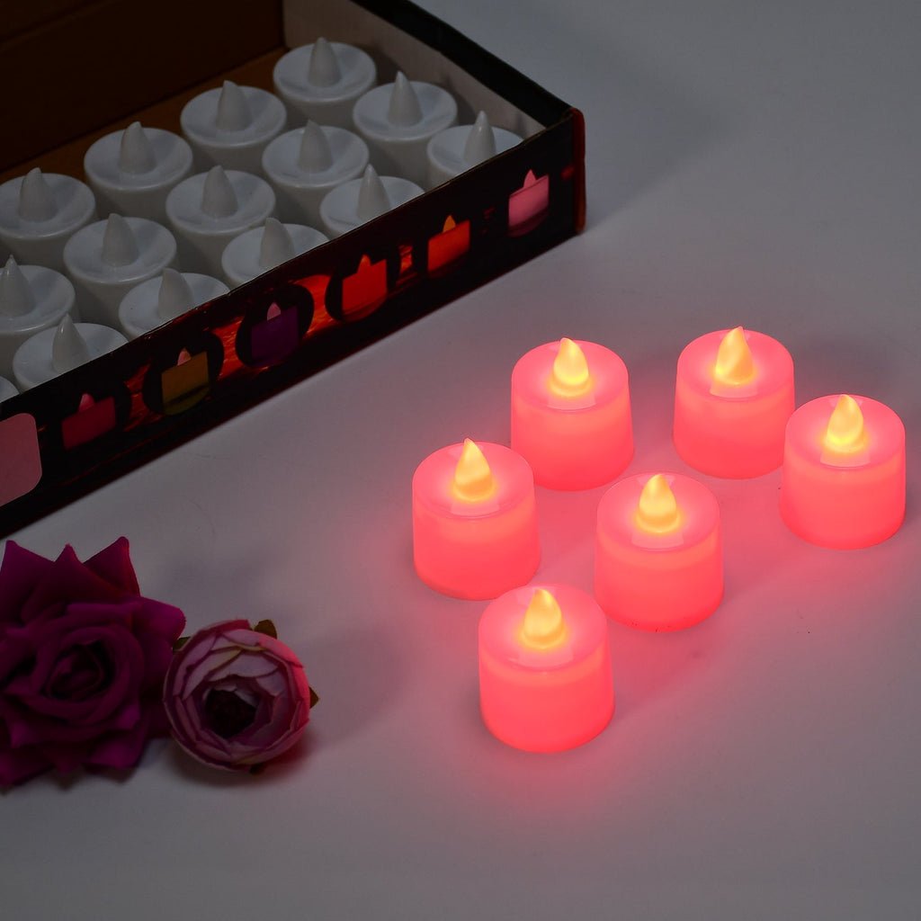 Red LED flameless tealight candles creating warm ambient light at a party setting