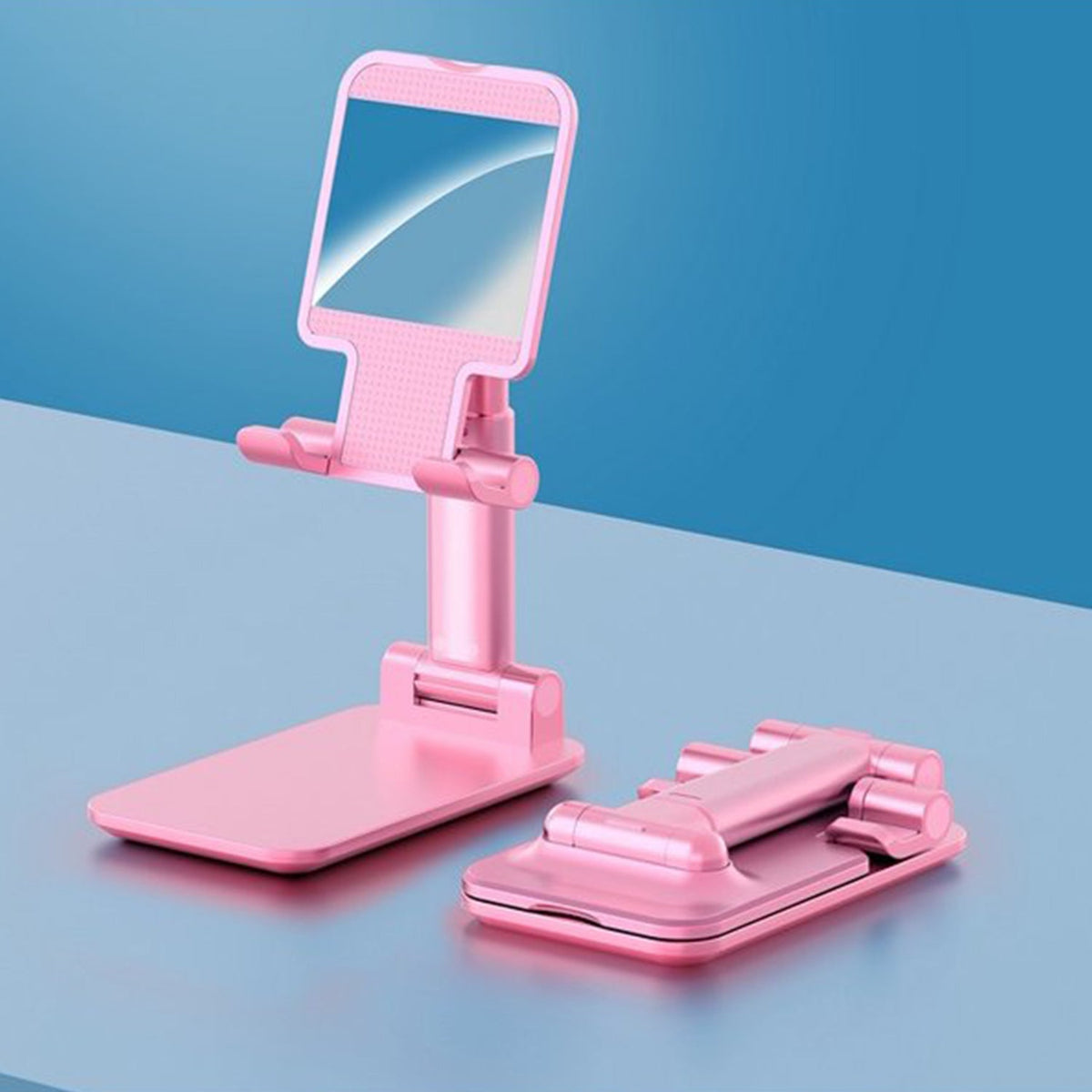 Adjustable phone stand with mirror on a desk, showcasing its compact design.