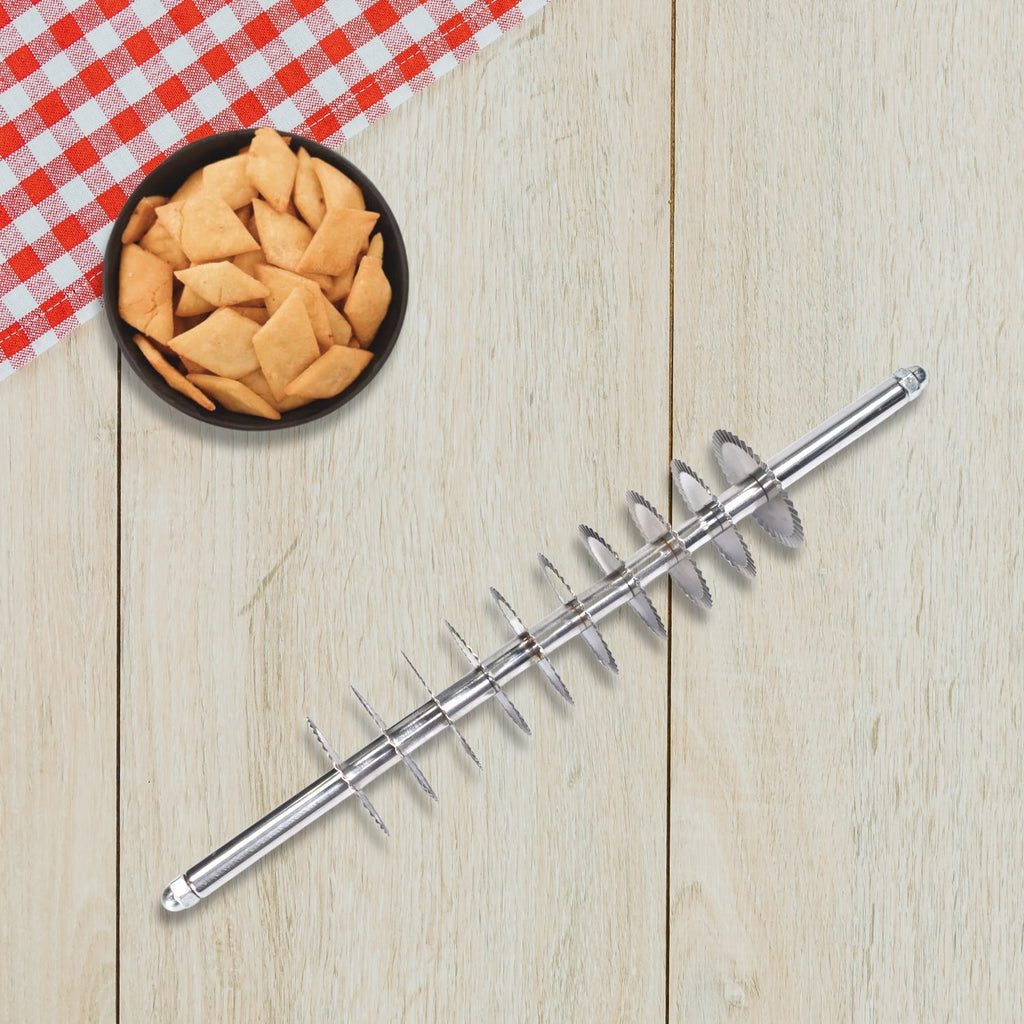 Stainless steel dough cutter with multiple wheels for uniform noodle and pastry cuts.