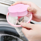 A hand demonstrating how to remove collected lint from the filter bag.