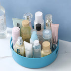 Turntable organizer on a dining table, holding various food items.