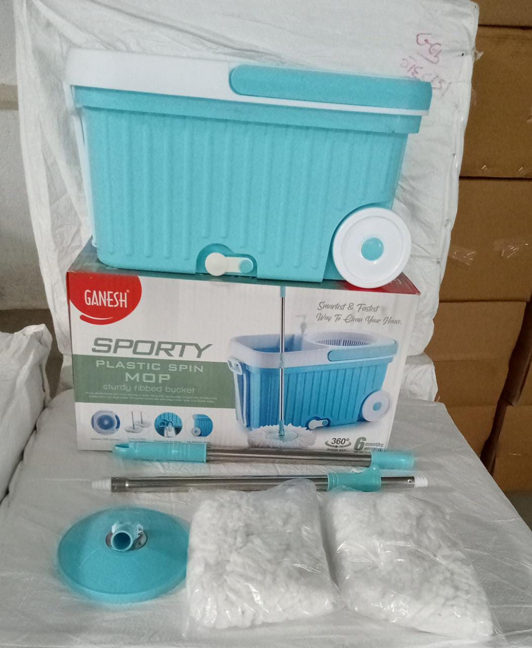 High-performance spin mop system with extra-large wheels for quick cleaning.