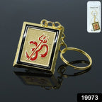 Close-up of metal keychain featuring Om Trishul symbol in golden finish