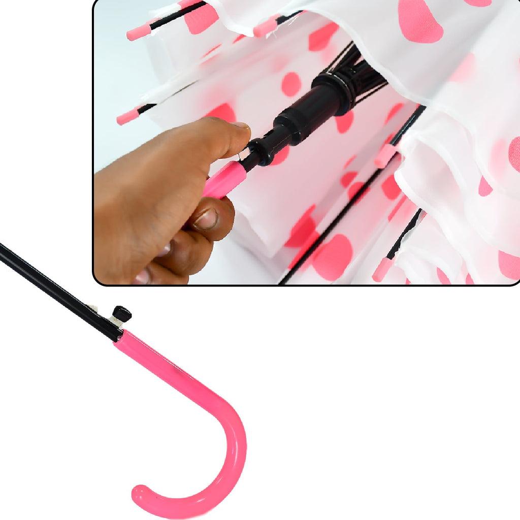 A person holding the multicolor dot printed umbrella against a bright background.