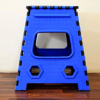 A Tidy Table 18-inch plastic step stool, folded, showing its compact design.