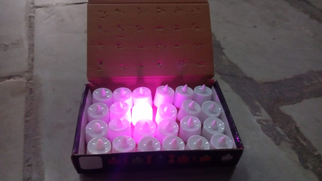 Several pink decorative LED candles creating a cozy atmosphere.