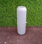 Textured capsule-shaped travel storage bottle from Organivo for secure grip.