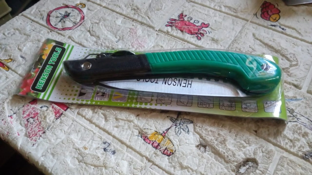 Multi-purpose folding handsaw demonstrating its capability for diverse cutting applications.