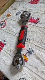 Full view of the multi-function tool, emphasizing its swivel head and multiple sockets.