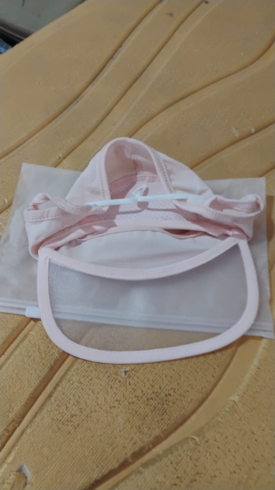 Visual demonstrating the full face coverage provided by the UV protection cap compared to a standard cap.