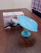 Self draining soap dish in active use, keeping soap dry.