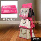 Side view of the hanging purse organizer with handbags, ideal for wardrobe storage.