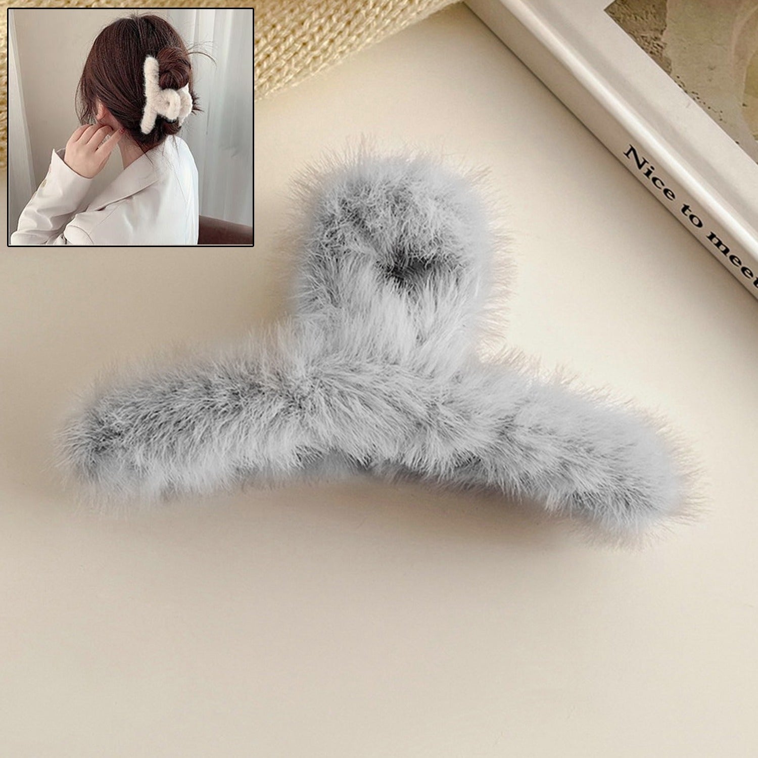 Elegant plush hair claw clip in a vibrant color, perfect for securing hair.