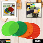 Four heat-resistant silicone hot pot mats stacked, ready to protect kitchen surfaces.