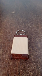 Wooden keychain placed in a lifestyle setting emphasizing natural style and functionality