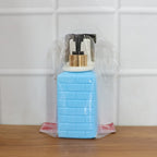 Alternate angle of wall-mounted liquid soap dispenser mounted on wall