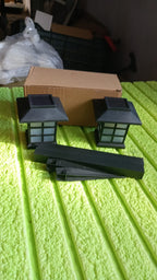 Packaging for the two-pack solar garden lights, emphasizing easy transport and setup.