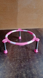 Single ring matka stand made of high-quality stainless steel on a wooden surface.