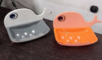 Top-down view of the wall mounted soap holder with a bar of soap, ready for use.