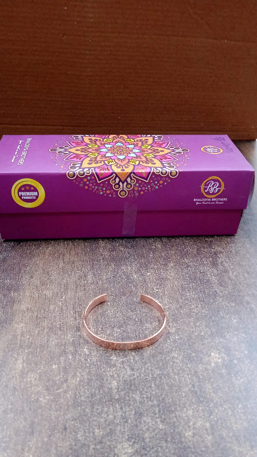 Close up of rose gold-plated open cuff bracelet design