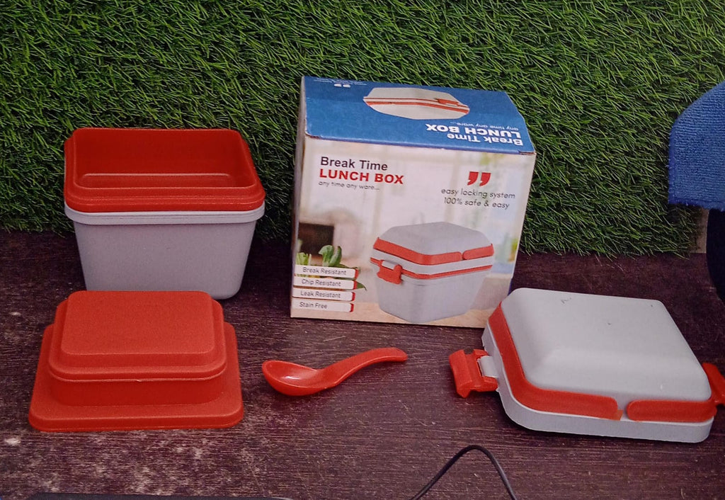 Empty sturdy lunch box with a clear lid, showcasing its airtight seal and handle.