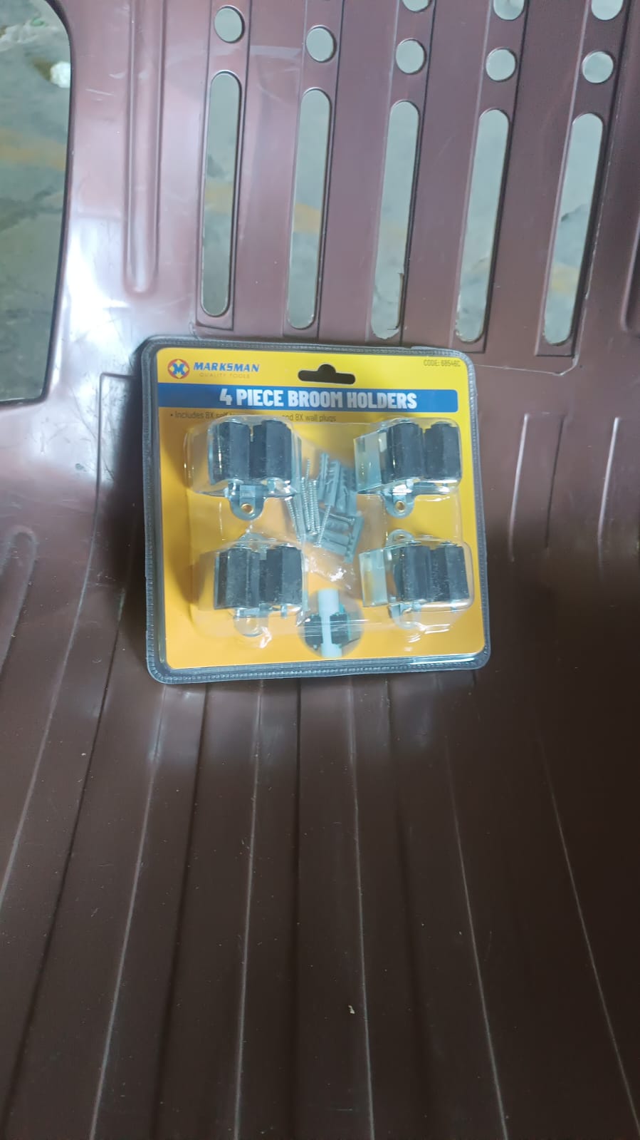 Full set of four GlimmerHome wall mount mop and broom holders in packaging.