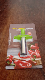 Chili corer next to a selection of fresh peppers, highlighting its use.