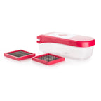 Ganesh vegetable chopper with various blade types laid out, showcasing its versatility.